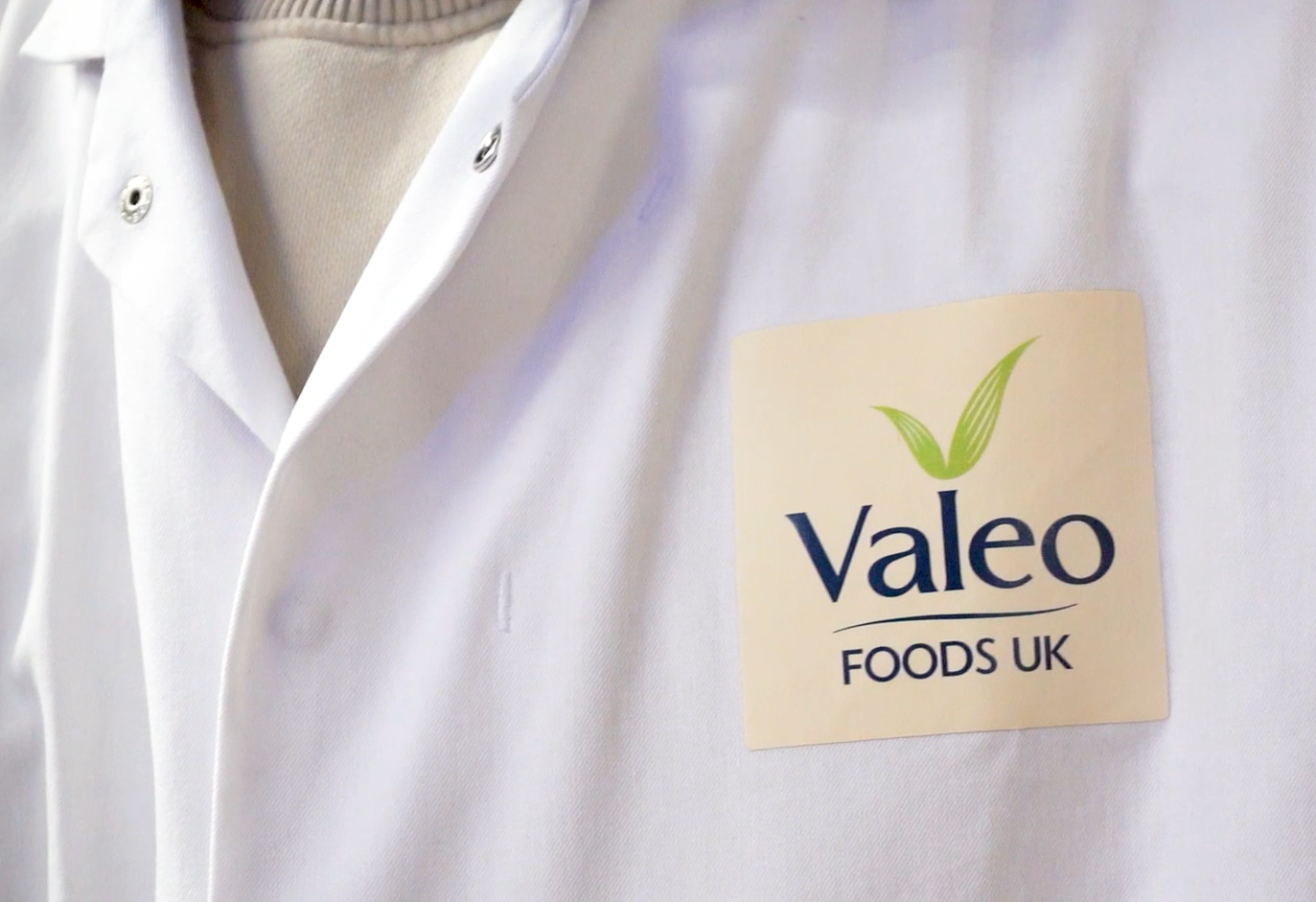 Valeo Foods Group standardised white uniform with logo Valeo Foods Group standardised white uniform with logo